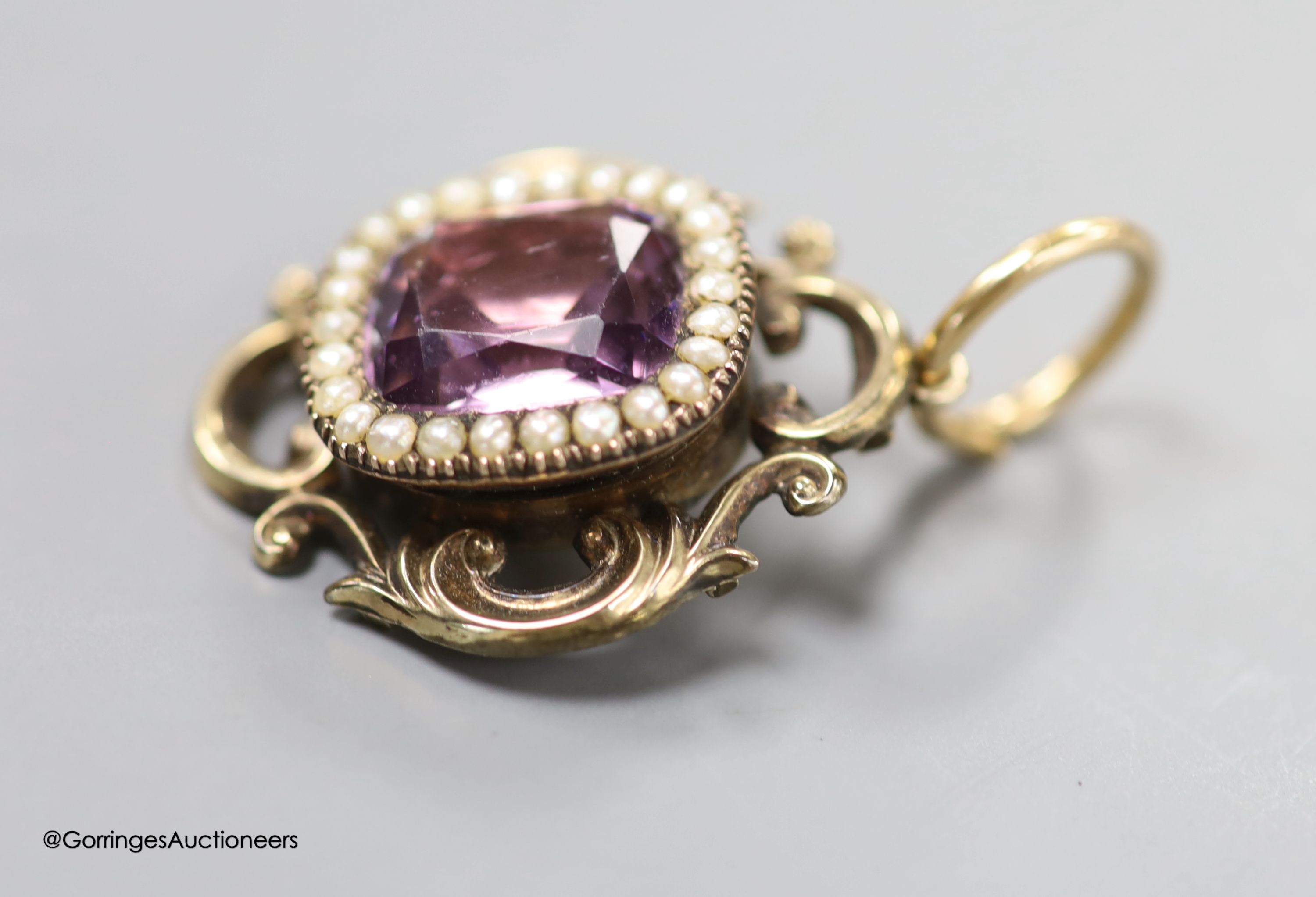 A late Victorian yellow metal foil backed? paste and seed pearl set pendant, 31mm, gross weight 8.5 grams.